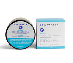 Scoop of Soapwalla deodorant on fingers demonstrating easy application and quick absorption