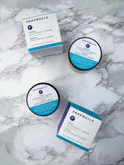 Soapwalla deodorant next to a coin for 2 oz size comparison showing travel-friendly portability