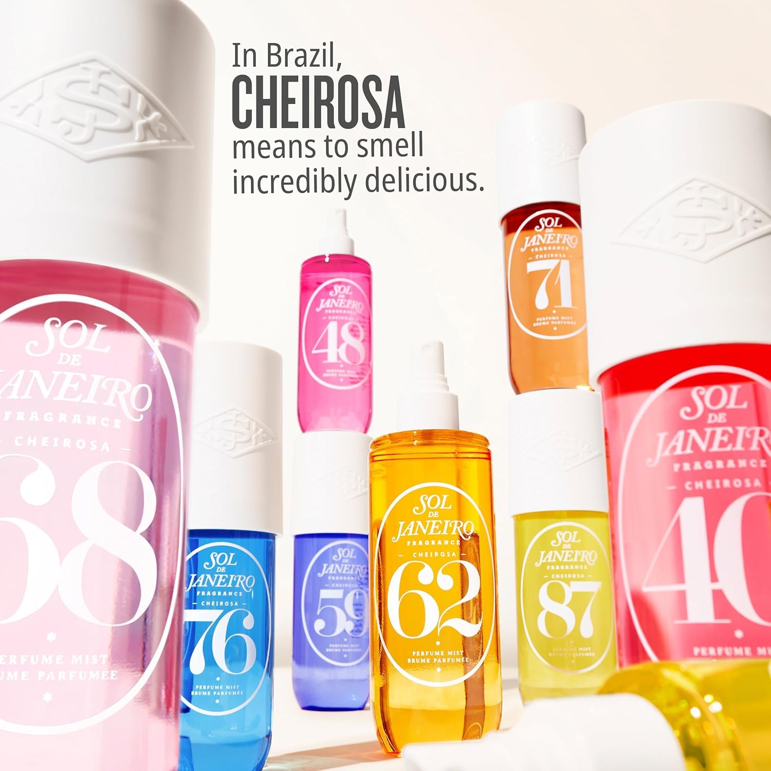 Sol de Janeiro mists tucked into a beach bag representing travel-ready fragrance refreshes benefit