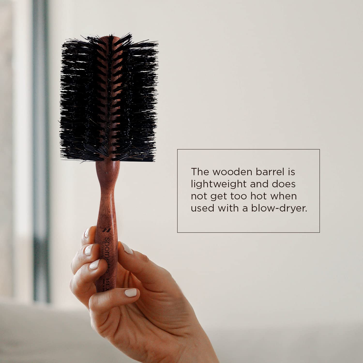 SPORNETTE brush in use while blow drying to add body and controlled waves