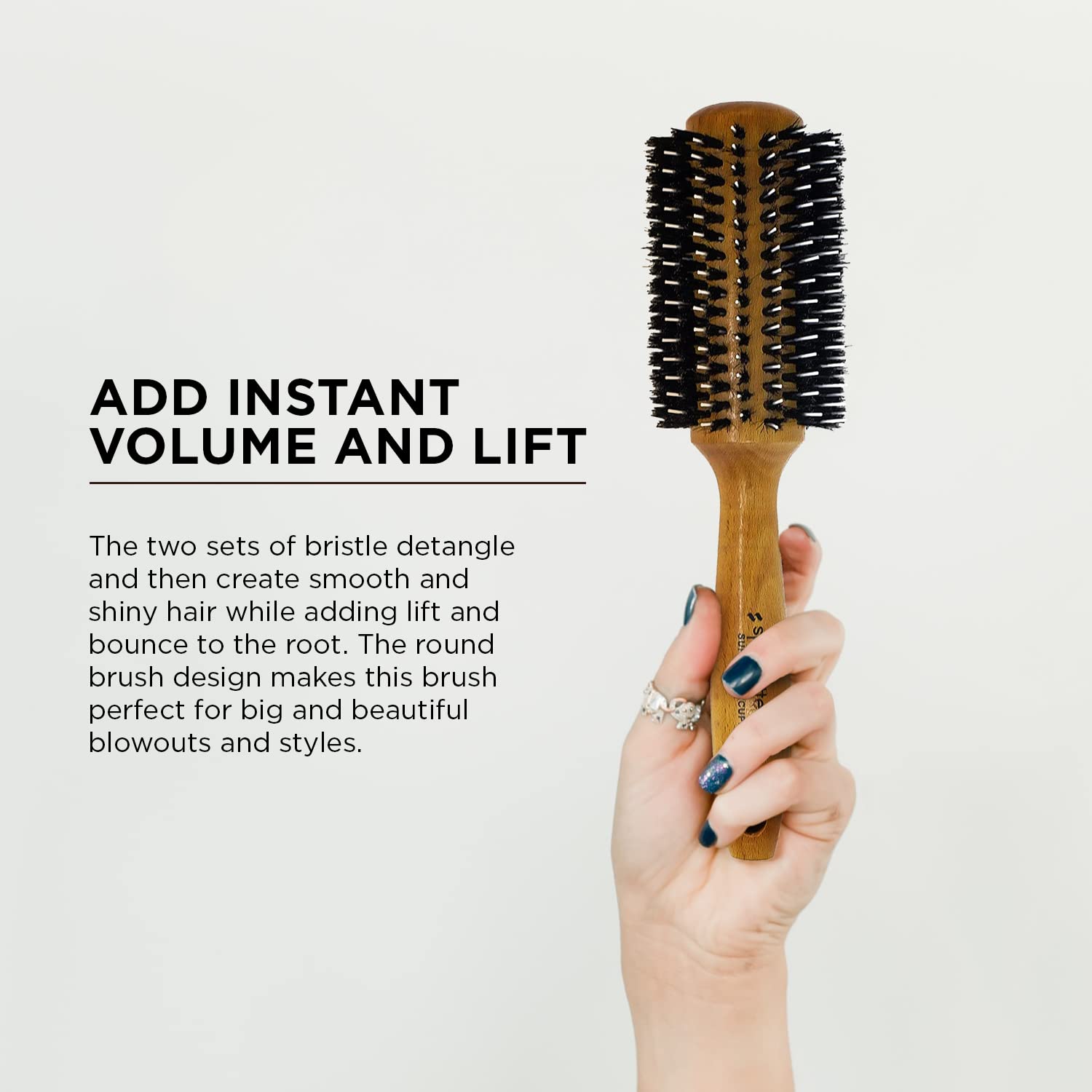 SPORNETTE brush in use during a blowout creating volume and sleek finish with dryer