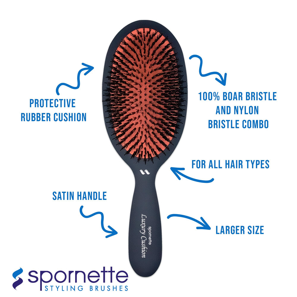 SPORNETTE hand holding brush to show lightweight size and easy maneuverability