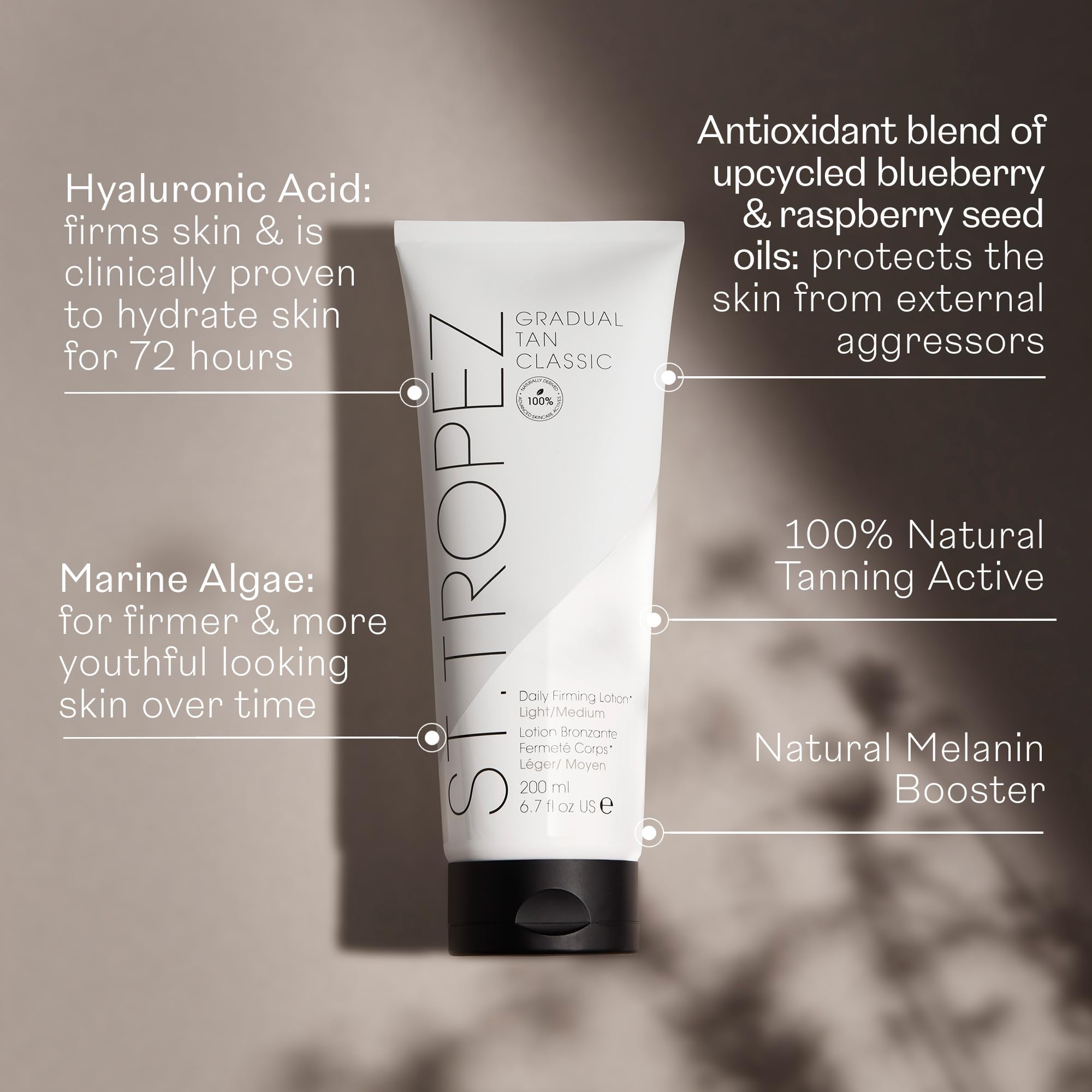 St.Tropez bottle held beside a hand to show size and easy daily use benefit