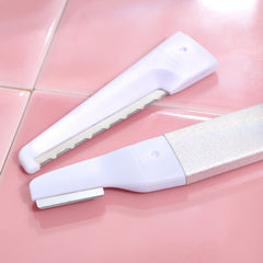 StackedSkincare blade attached to handle for scale showing compact precision area fit