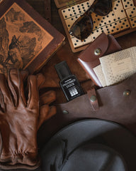 Stetson bottle on wood surface highlighting warm woody notes and natural depth