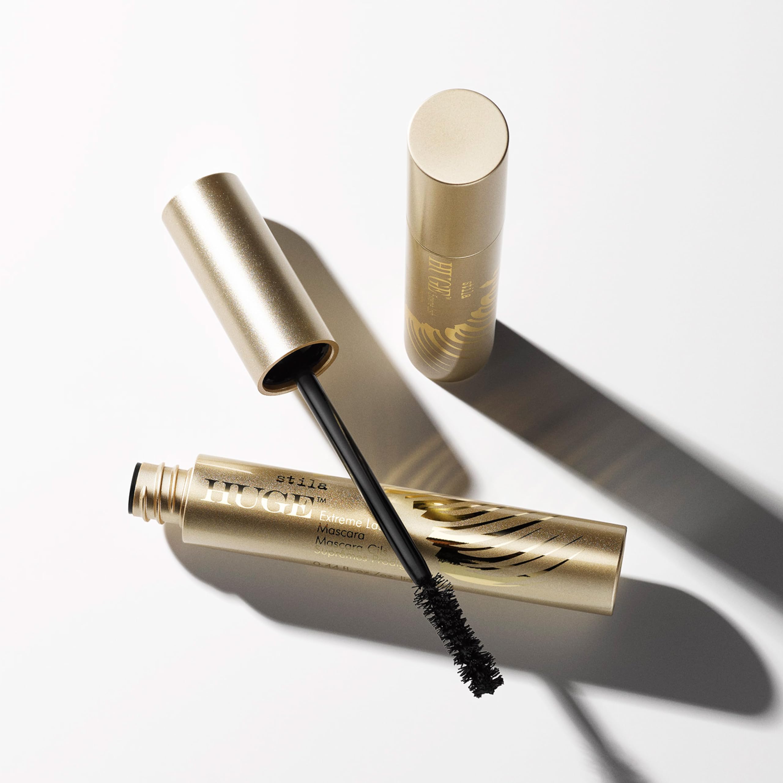 stila HUGE mascara swatches on skin showing rich black payoff and blendability