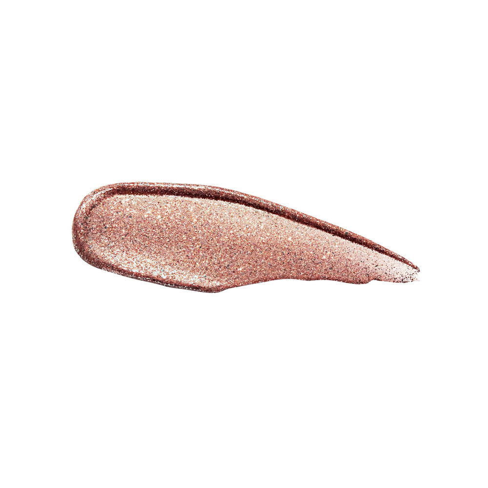 stila tube in hand for size comparison showing portable travel-friendly glitter eyeshadow