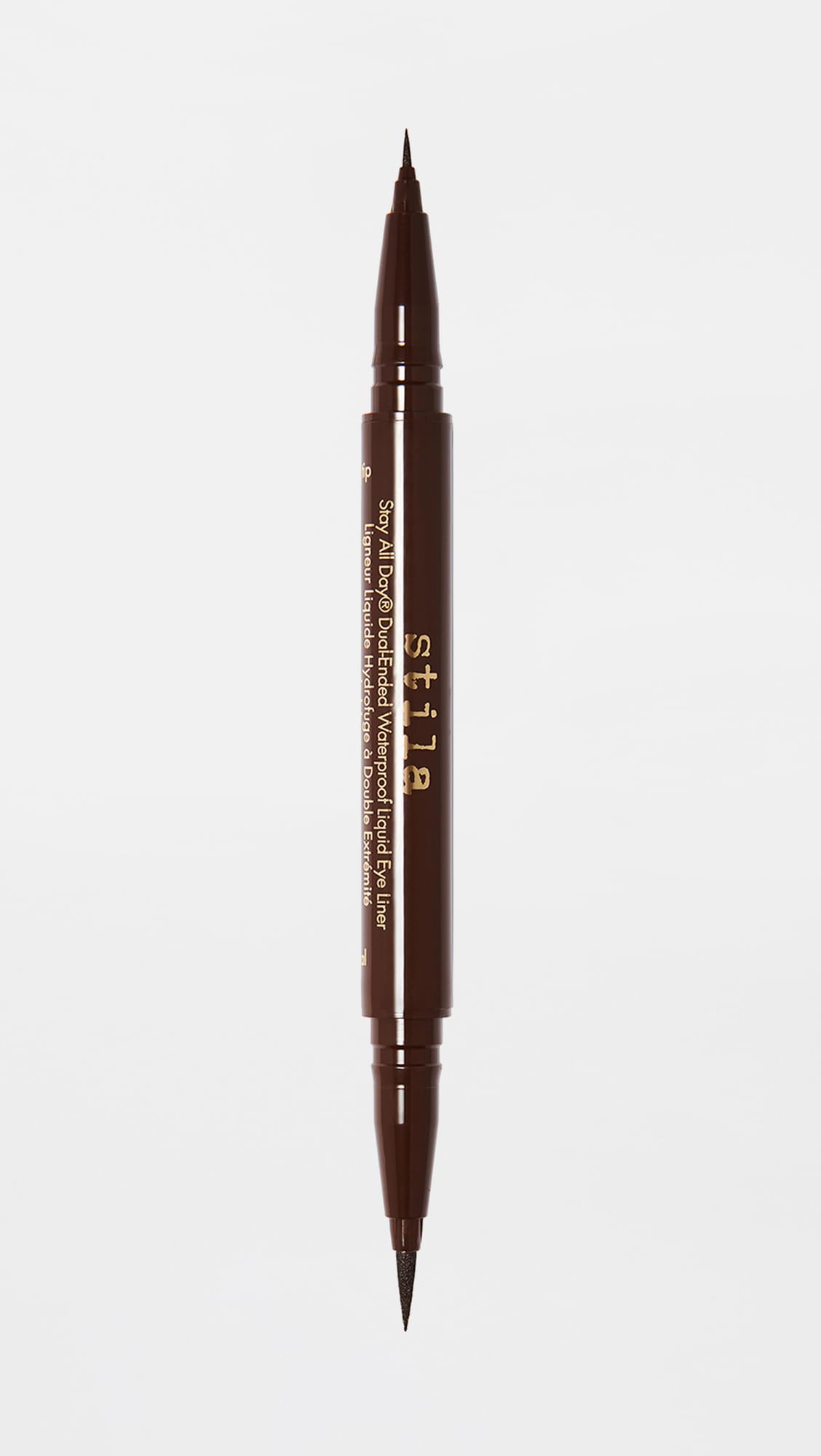 stila packaging beside common items to show compact size and travel ease