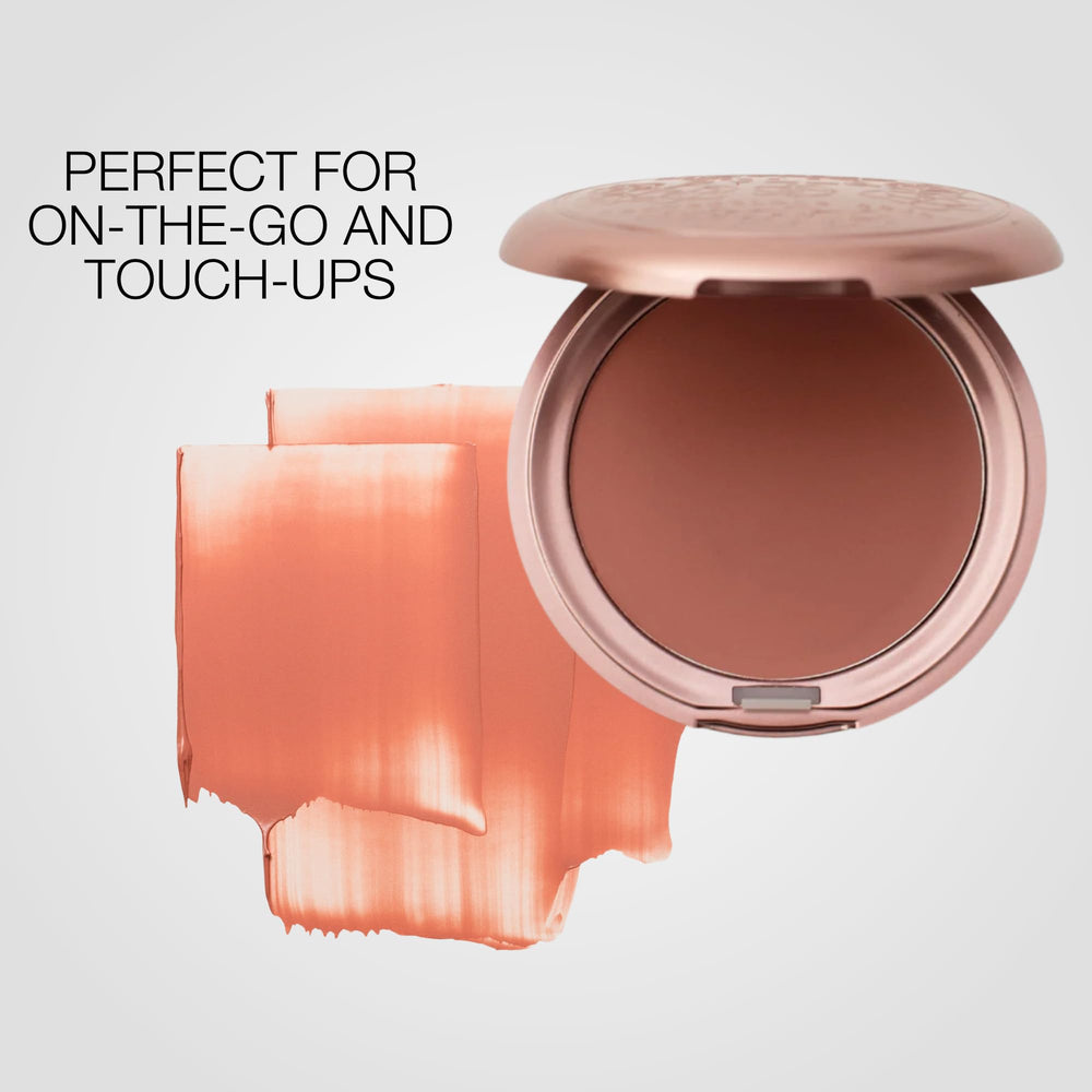 stila compact held next to coin to show travel-friendly size and convenience benefit