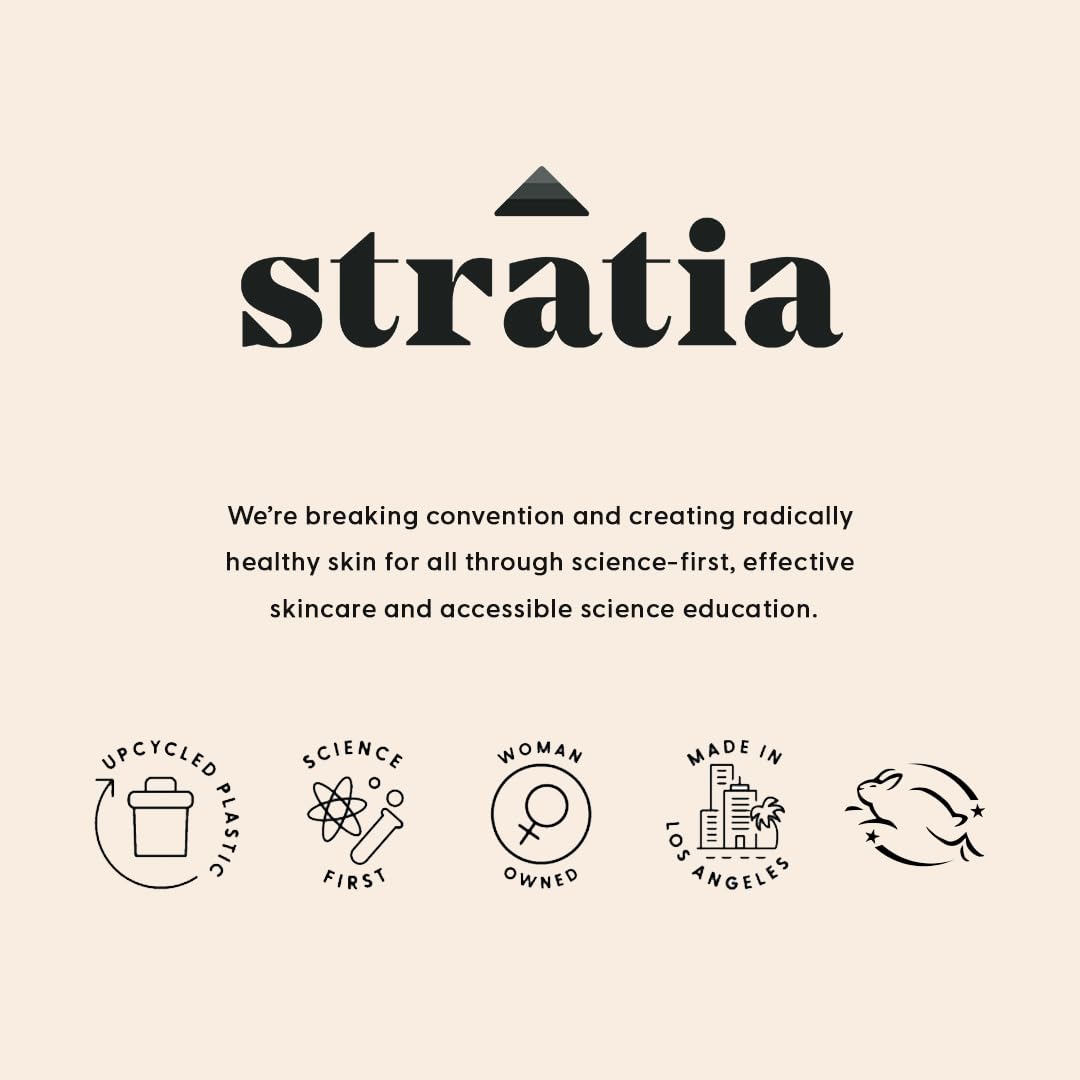 Stratia bottle on bathroom shelf styled with towels, complements daily routine