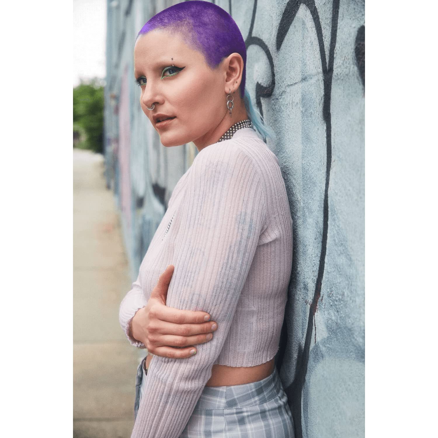 Strawberry Leopard lifestyle model with grapefruit-toned hair demonstrating vibrant finish