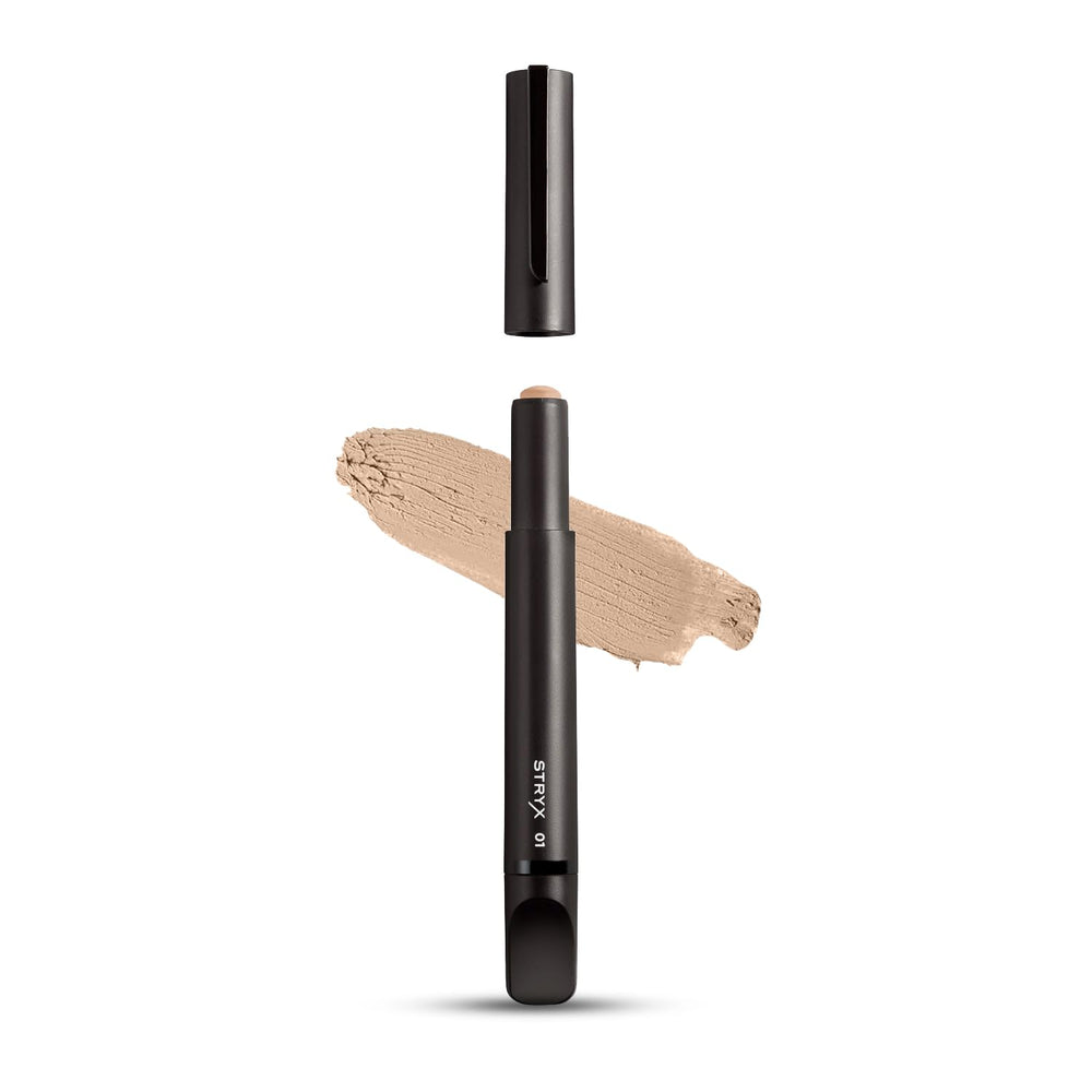Stryx concealer stick front view showing sleek tube and discreet design benefit