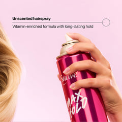 Suave max hold aerosol spraying over styled hair demonstrating long-lasting hold benefit