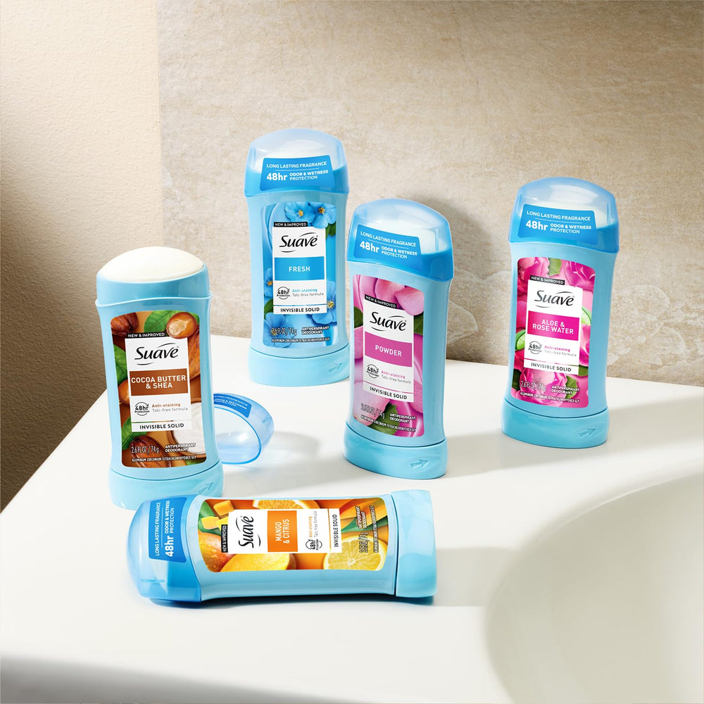 suave+ held in hand to show 2.6 oz size and travel-friendly portability