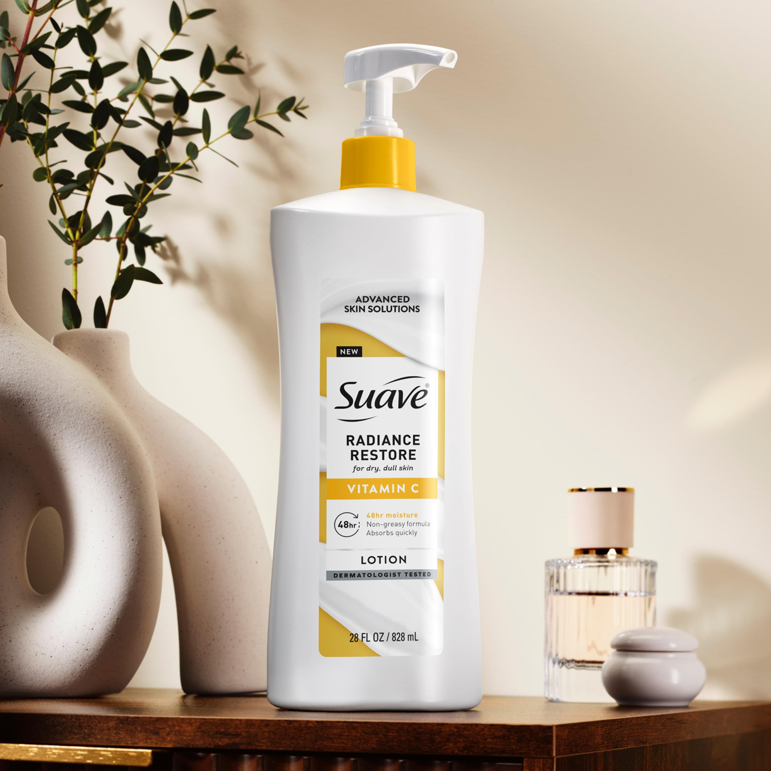 Suave bottle next to common objects to show size and value of 28oz