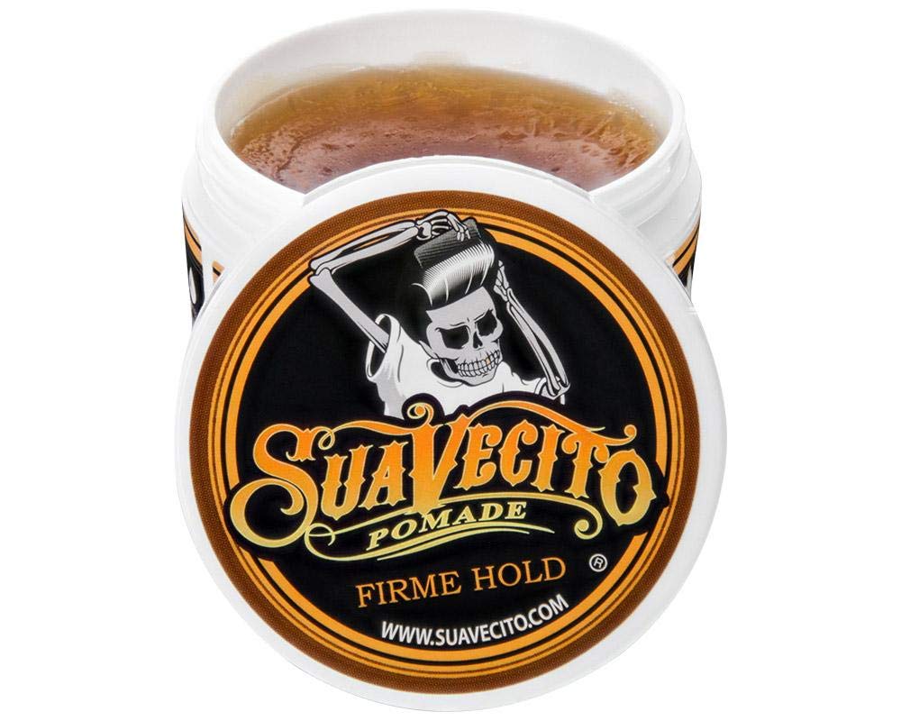 Suavecito Pomade held in hand to show 5 oz size and travel-friendly benefit