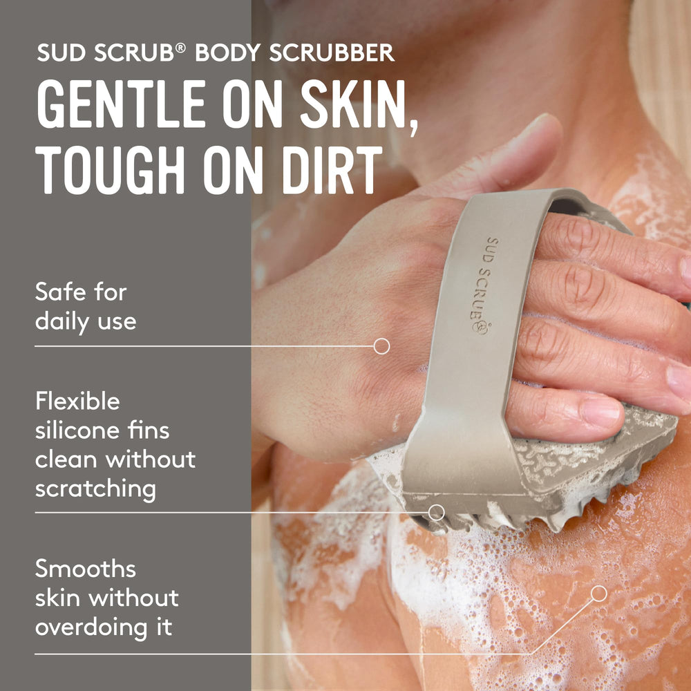 Sud Scrub in wet hand during shower, non-slip grip prevents dropping