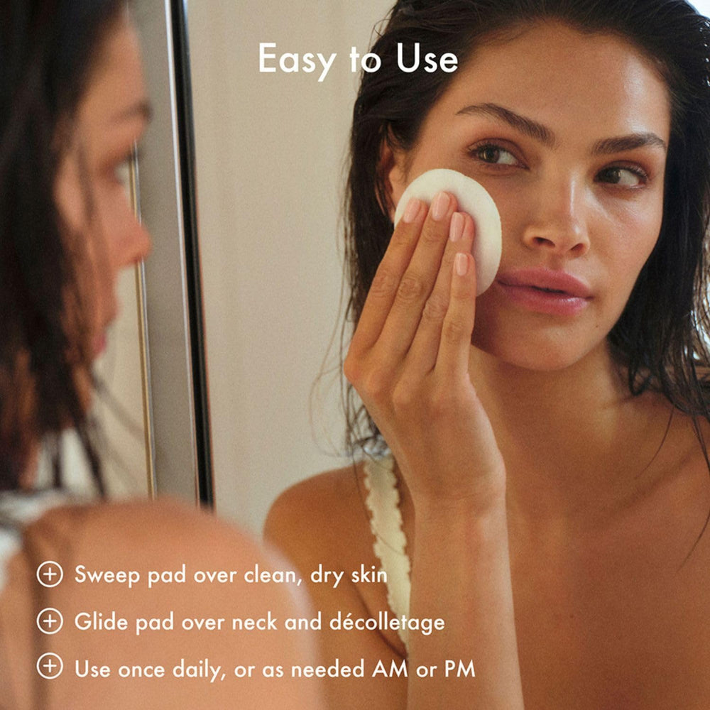 Summer Fridays pad being applied to cheek for exfoliation and smoother skin
