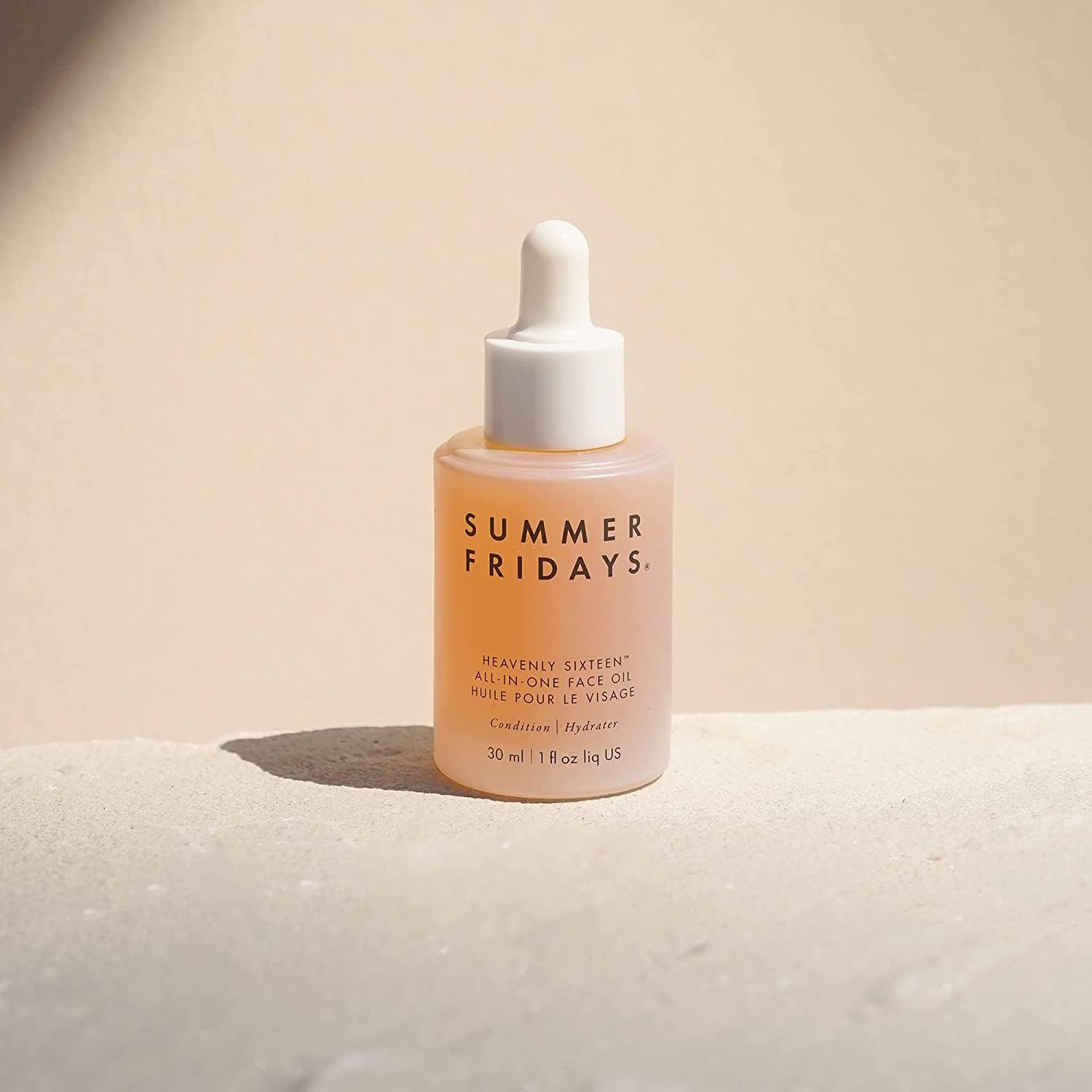 Summer Fridays dropper pouring oil showing lightweight texture and easy dosing benefit