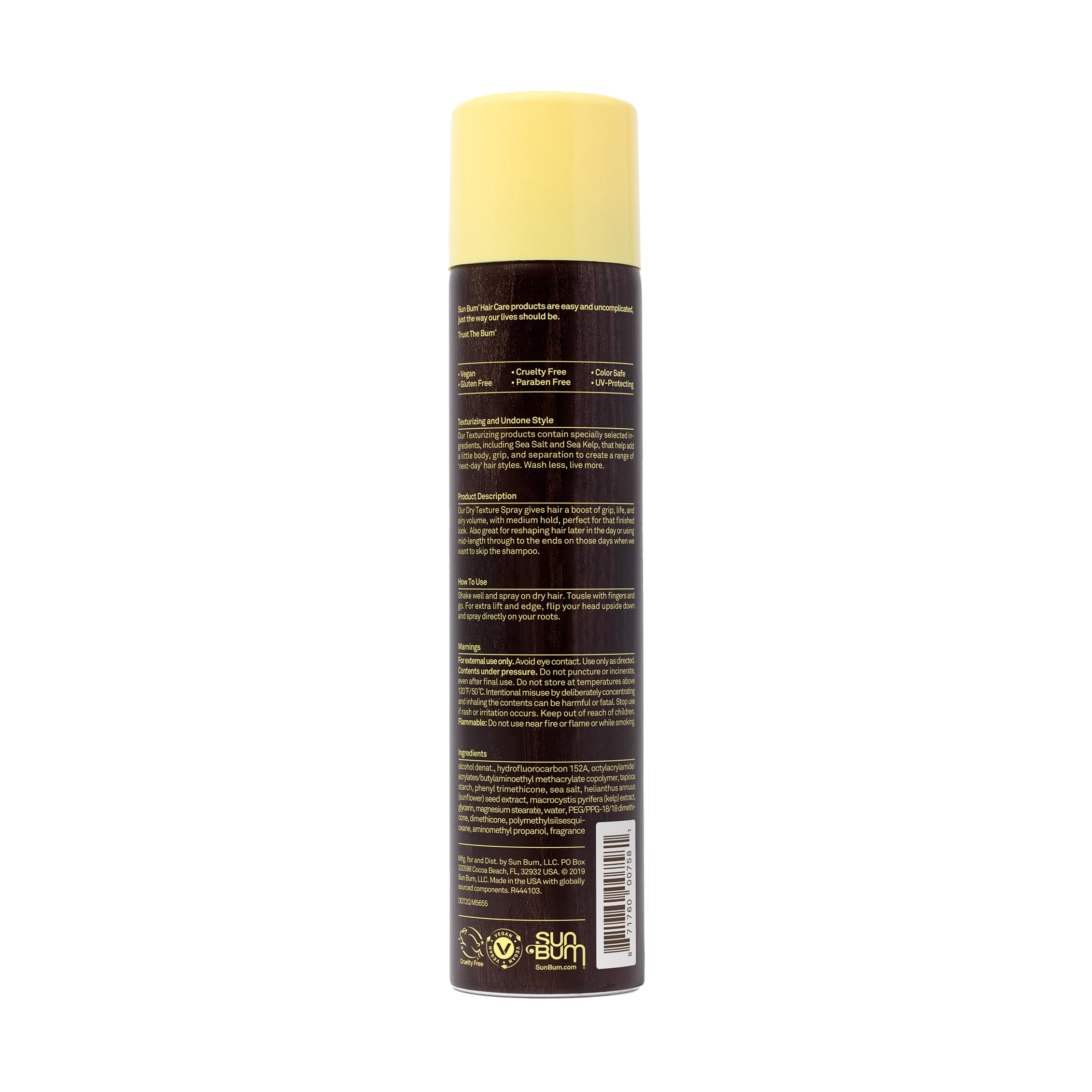 Sun Bum texture spray on a towel at beach illustrating UV protection and beach look