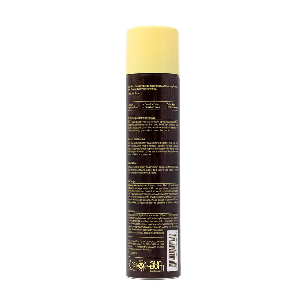 Sun Bum texture spray on a towel at beach illustrating UV protection and beach look