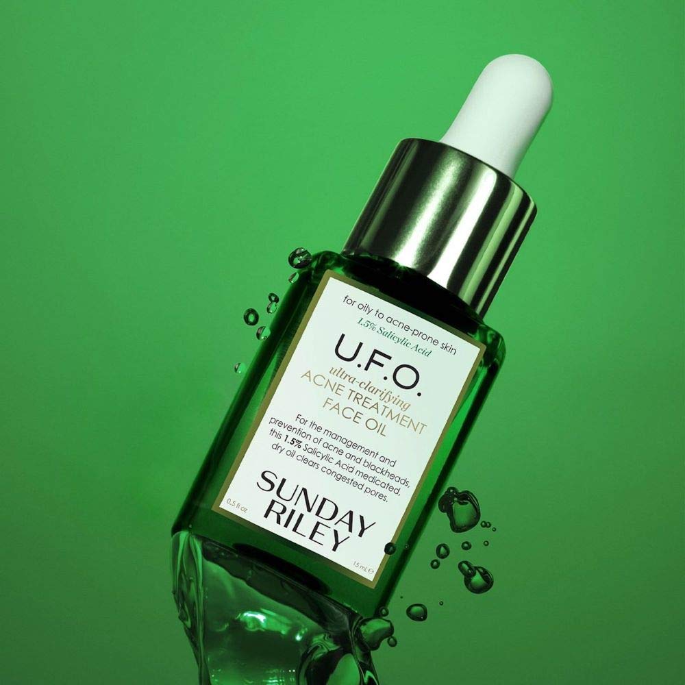 Sunday Riley U.F.O. bottle beside a coin for size comparison and travel‑friendly convenience