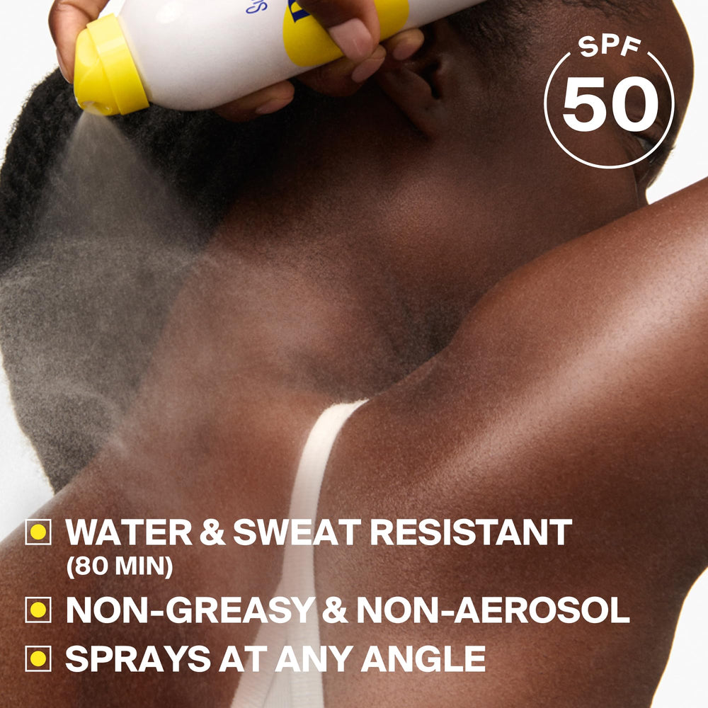 Supergoop! mist in action on arm demonstrating easy coverage and quick reapplication