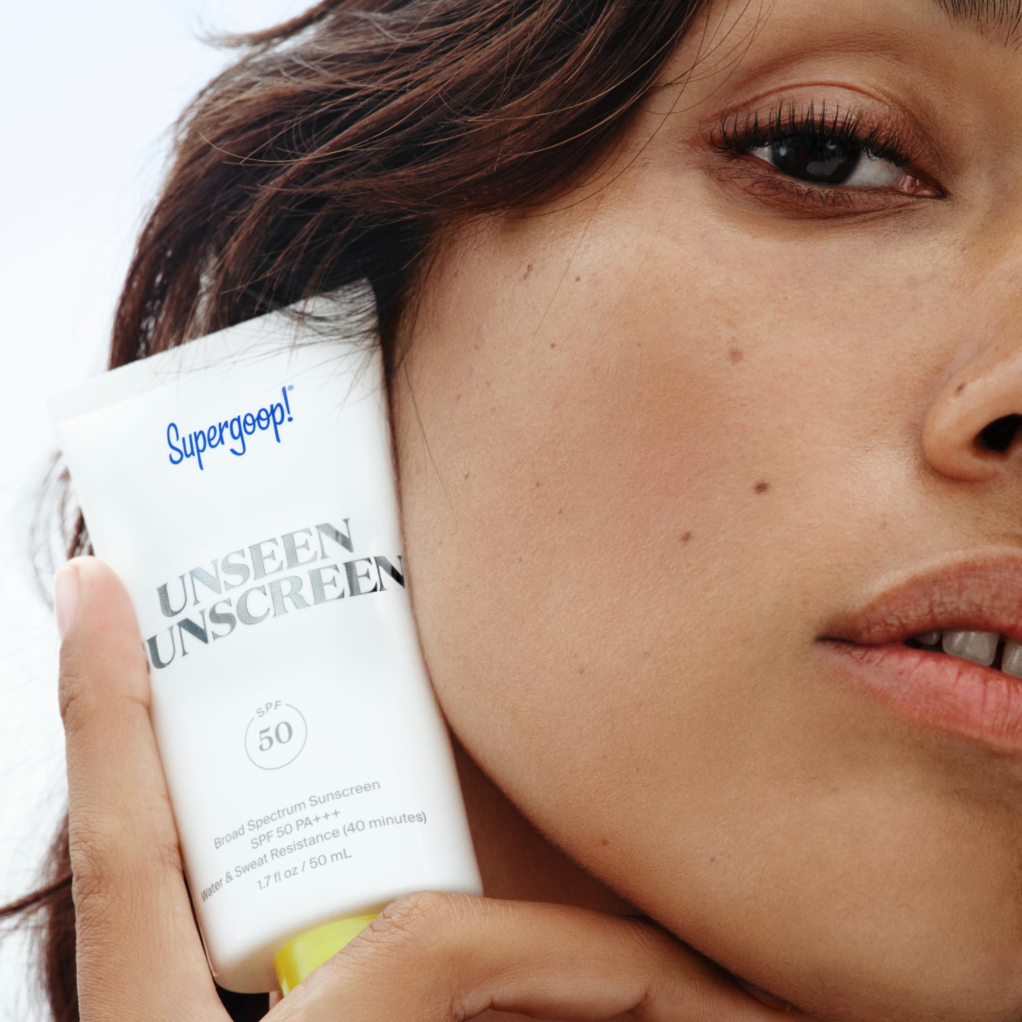Supergoop! Unseen packed in a toiletry bag for on-the-go daily protection benefit
