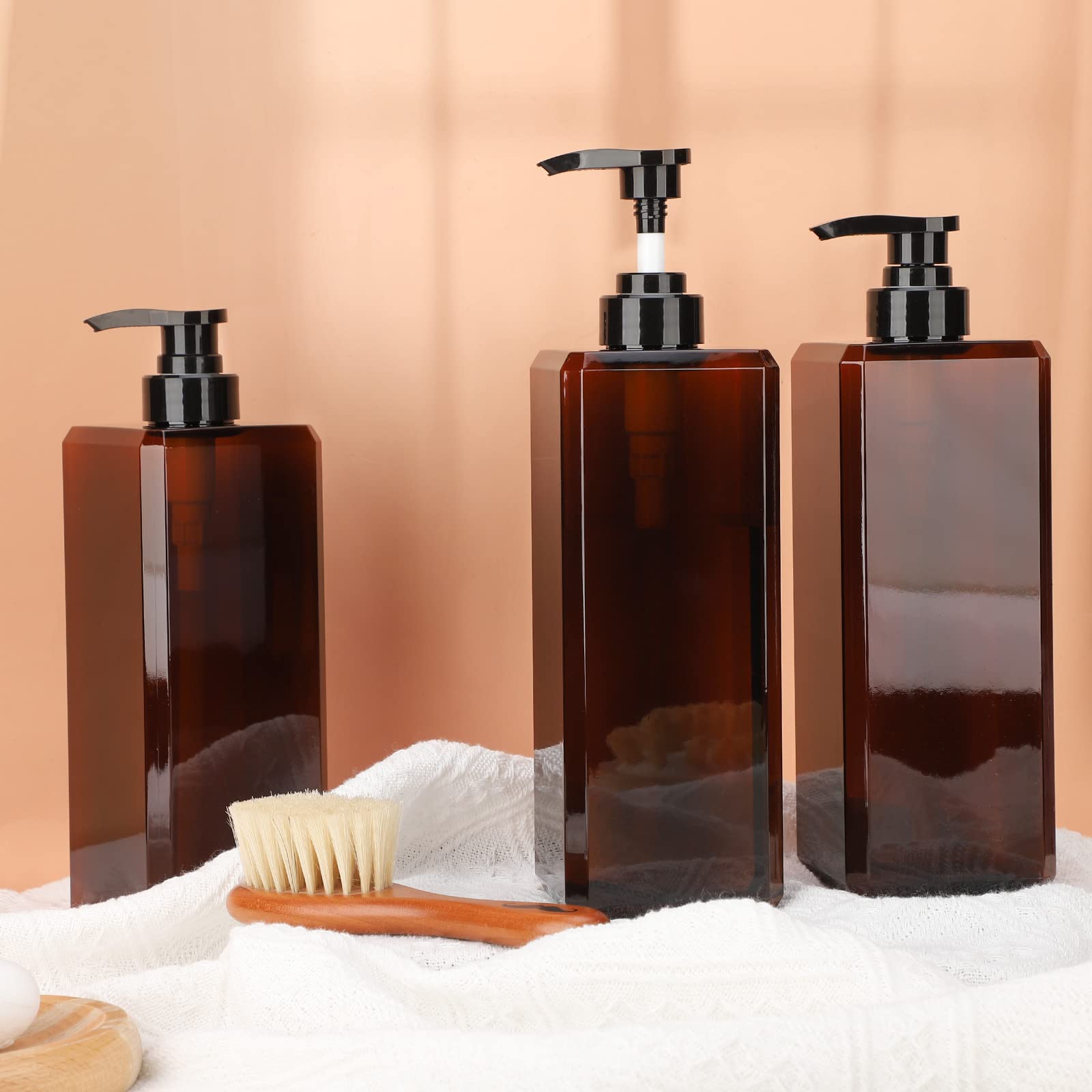SUREAM bottle held beside a hand to show true 33.8oz size and scale