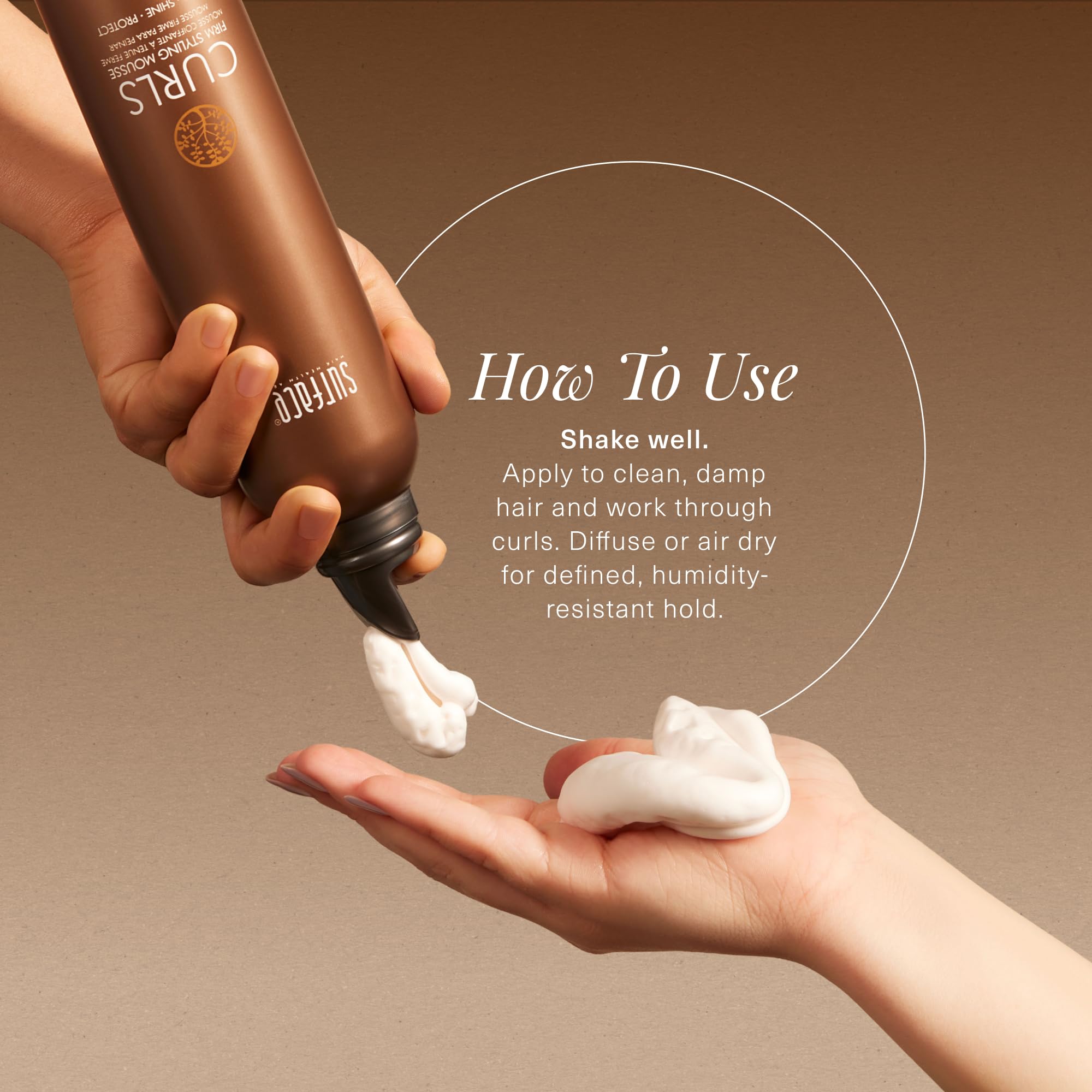 SURFACE applying mousse to damp hair with scrunch motion for defined curls