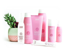Surface Trinity conditioner being rinsed in shower demonstrating detangle benefit