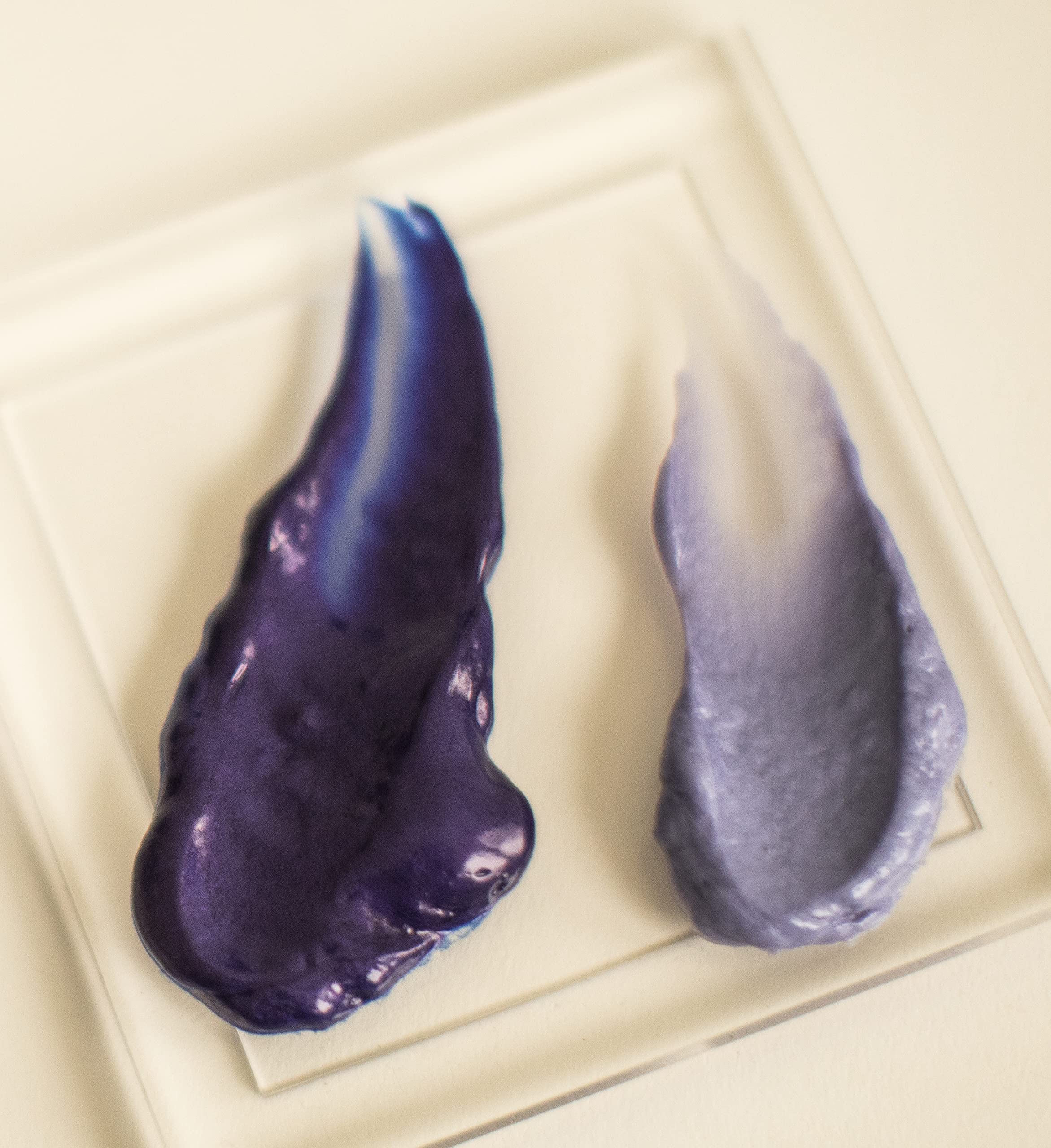 Hand holding Surface 7 oz bottle to show size and travel-friendly scale