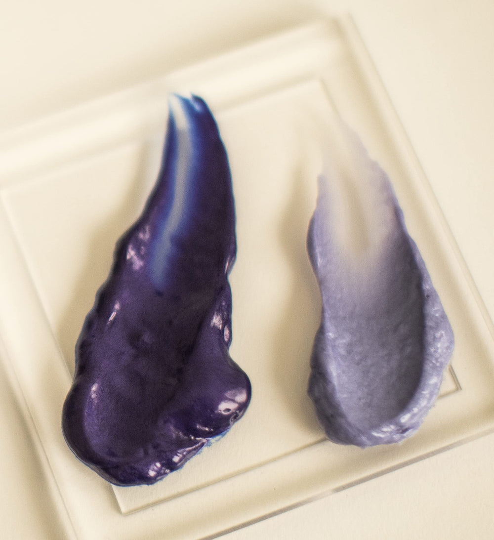 Hand holding Surface 7 oz bottle to show size and travel-friendly scale