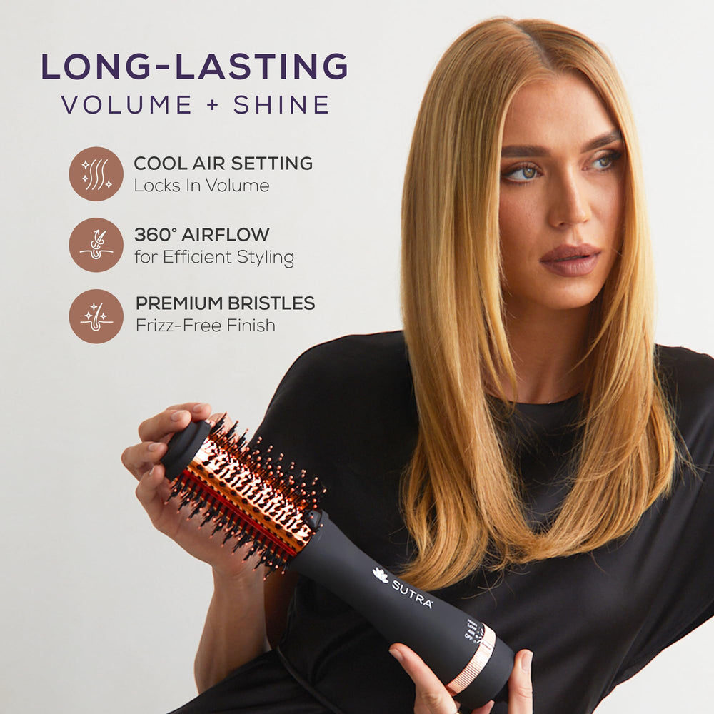 SUTRA brush handheld for scale to show compact, salon-style ergonomics