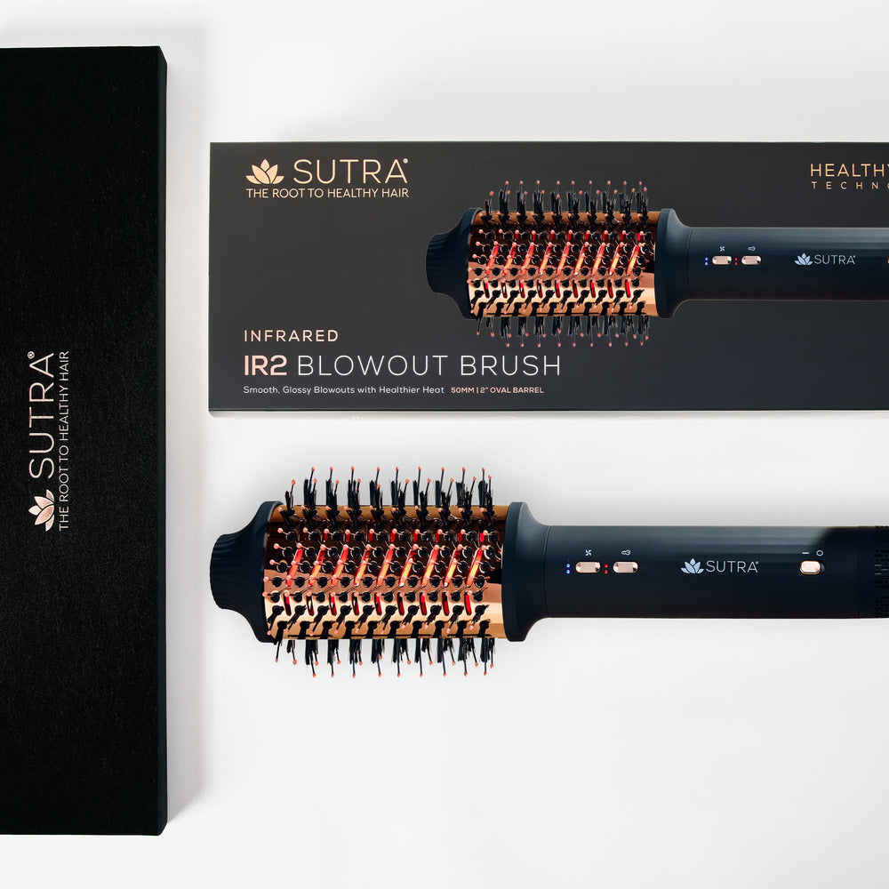 SUTRA IR2 on bathroom counter with styling products for easy at-home blowouts