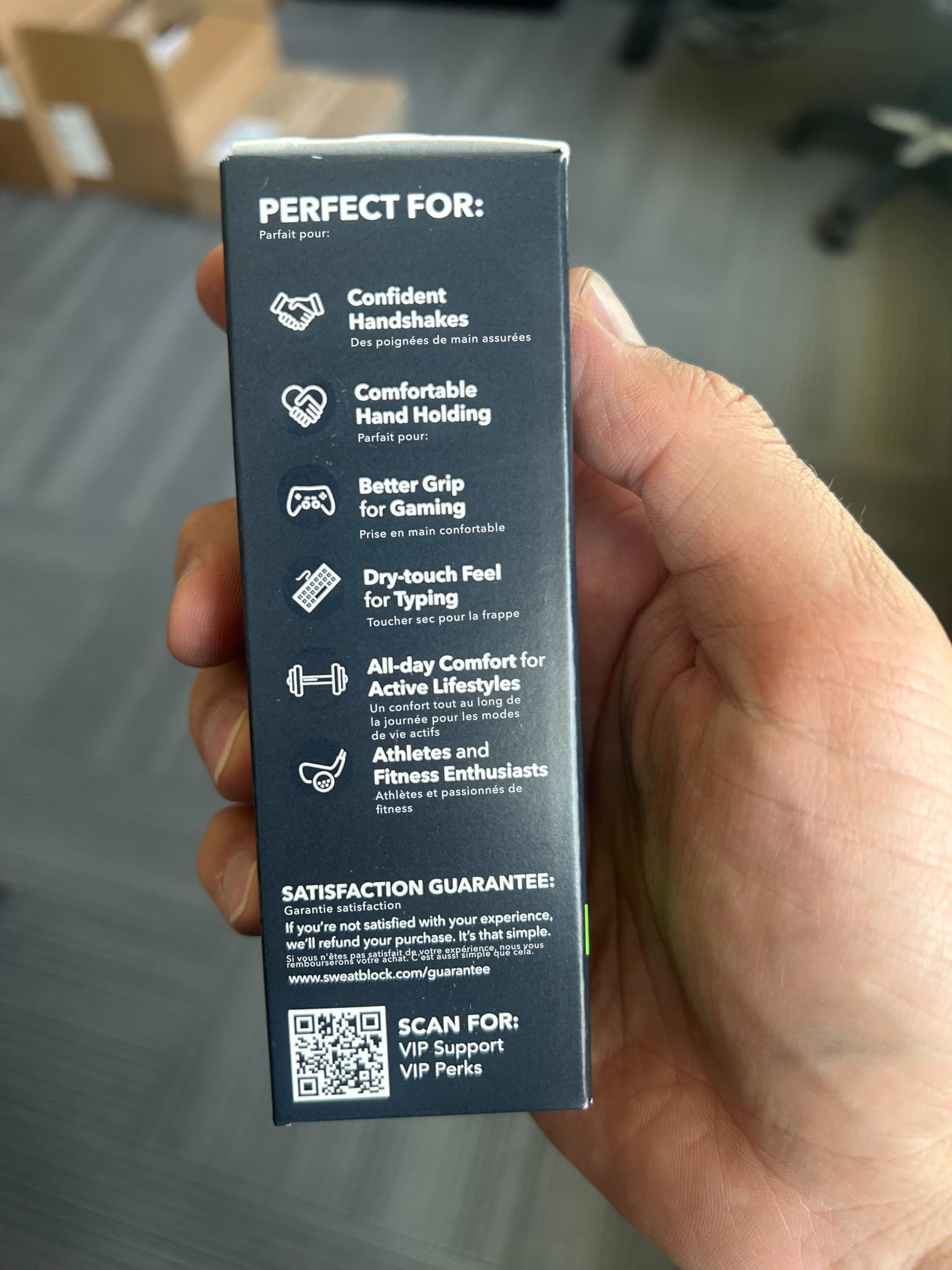 SweatBlock bottle next to phone in pocket showing travel-friendly size advantage