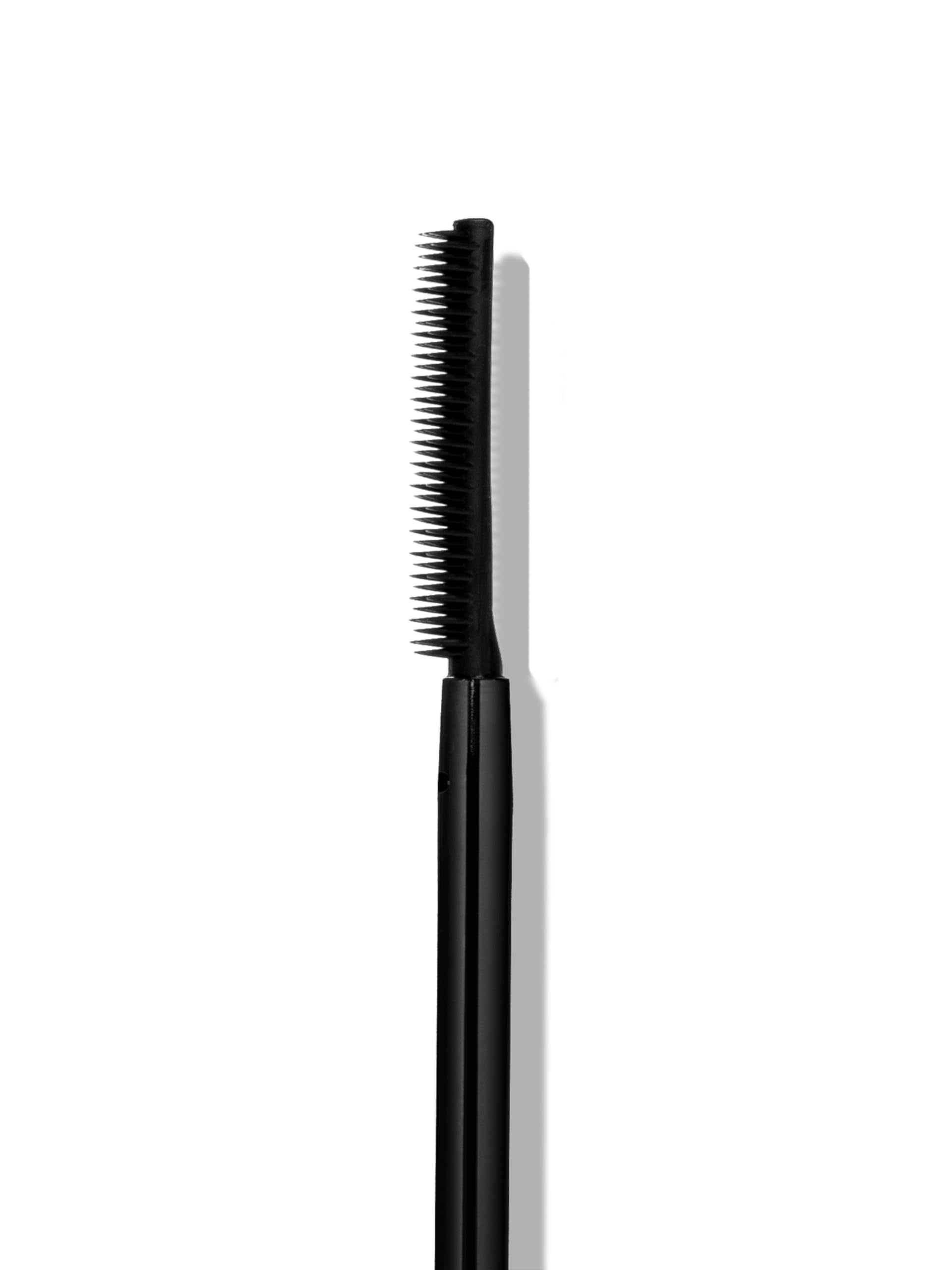 Sweed mascara next to ruler for size scale, compact travel-friendly packaging