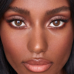 Sweed applying cluster lashes with tweezers showing precise placement and easy control