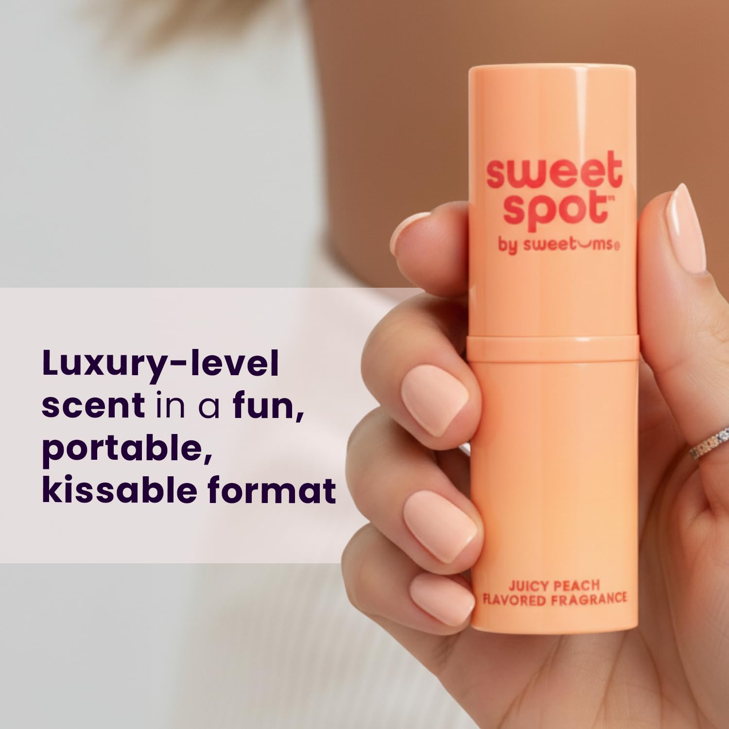 Sweetums applying to wrist showing discreet touchup and lasting scent