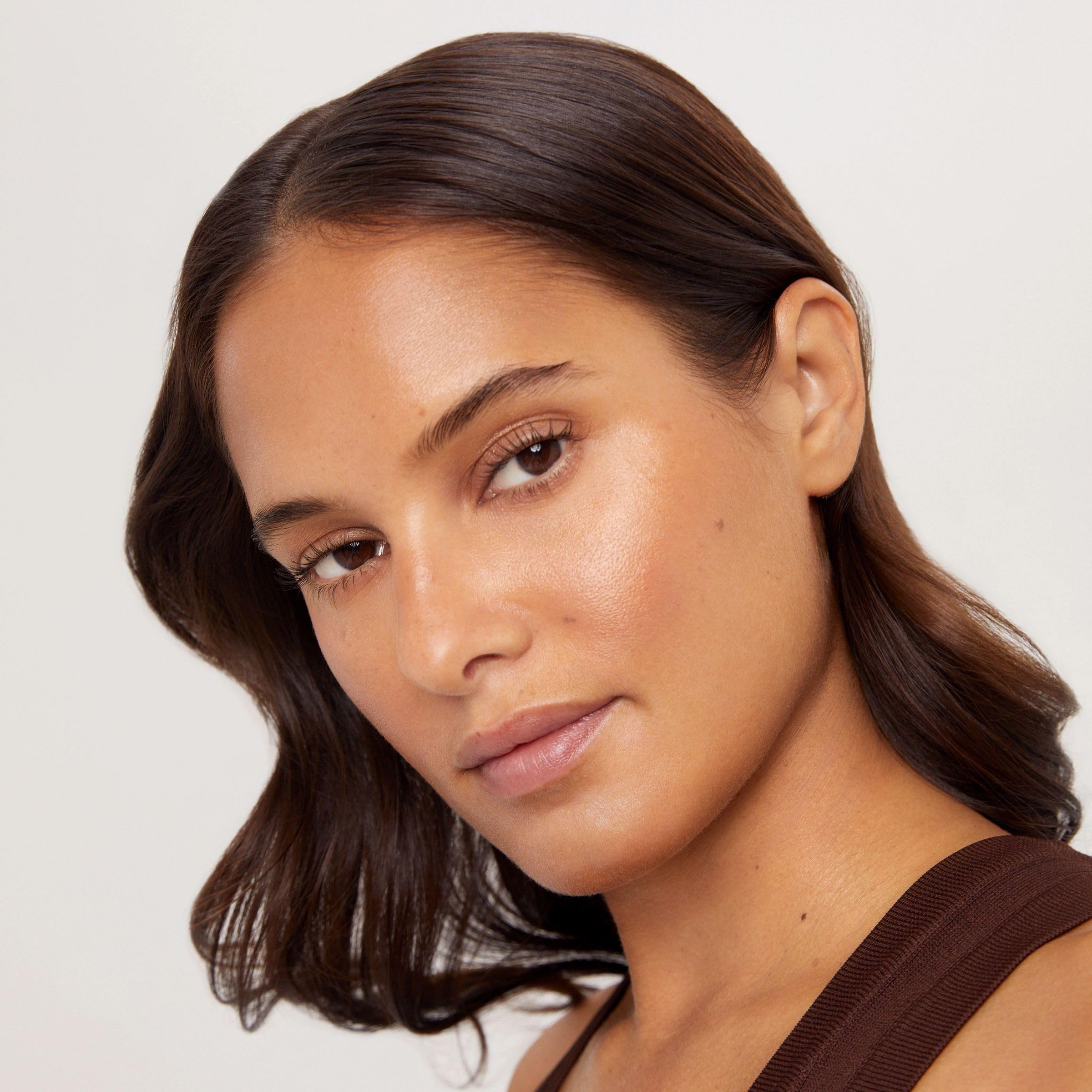 TAN-LUXE lifestyle bathroom shelf styled to show everyday skincare use