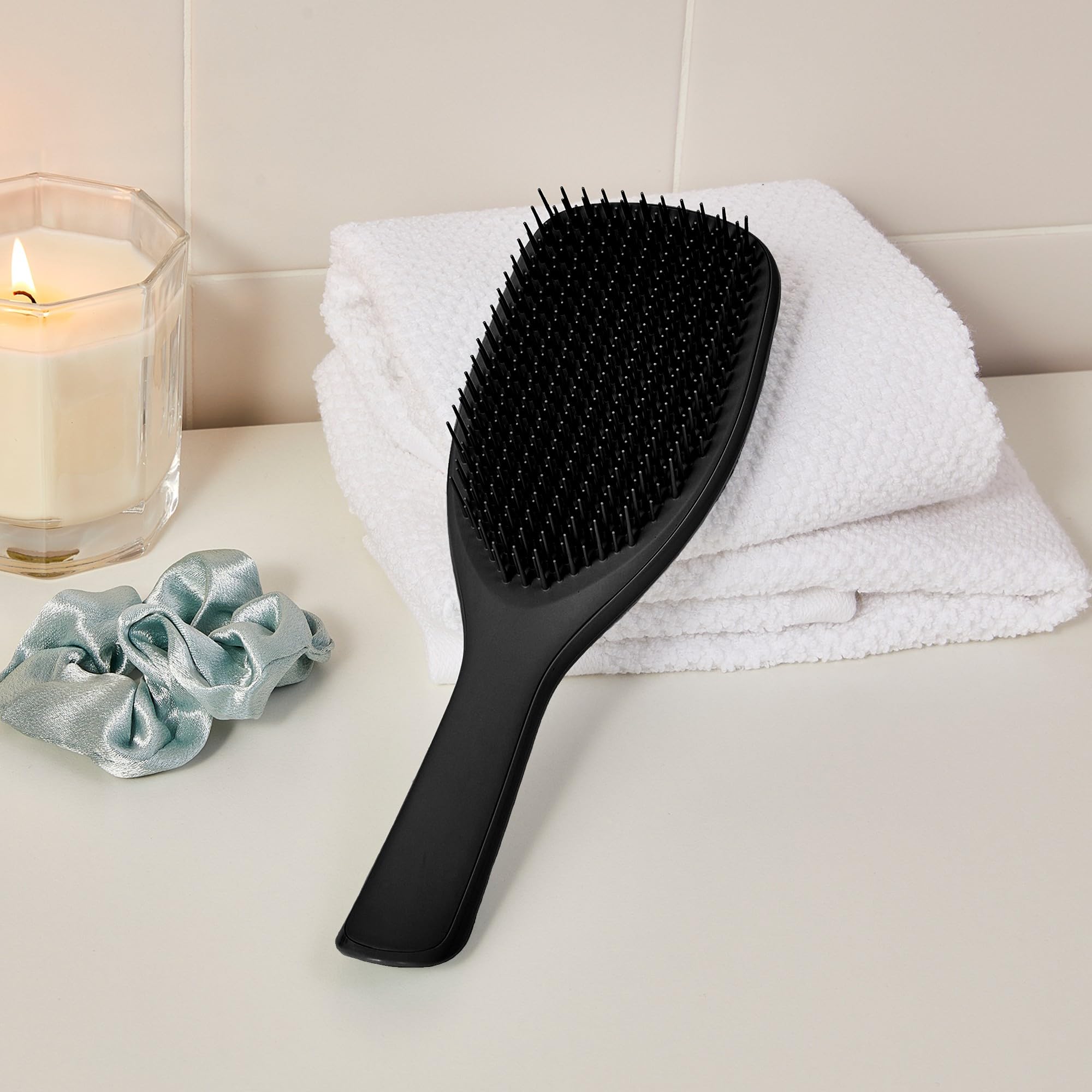 TANGLE TEEZER placed on bathroom counter in lifestyle scene for daily routine appeal