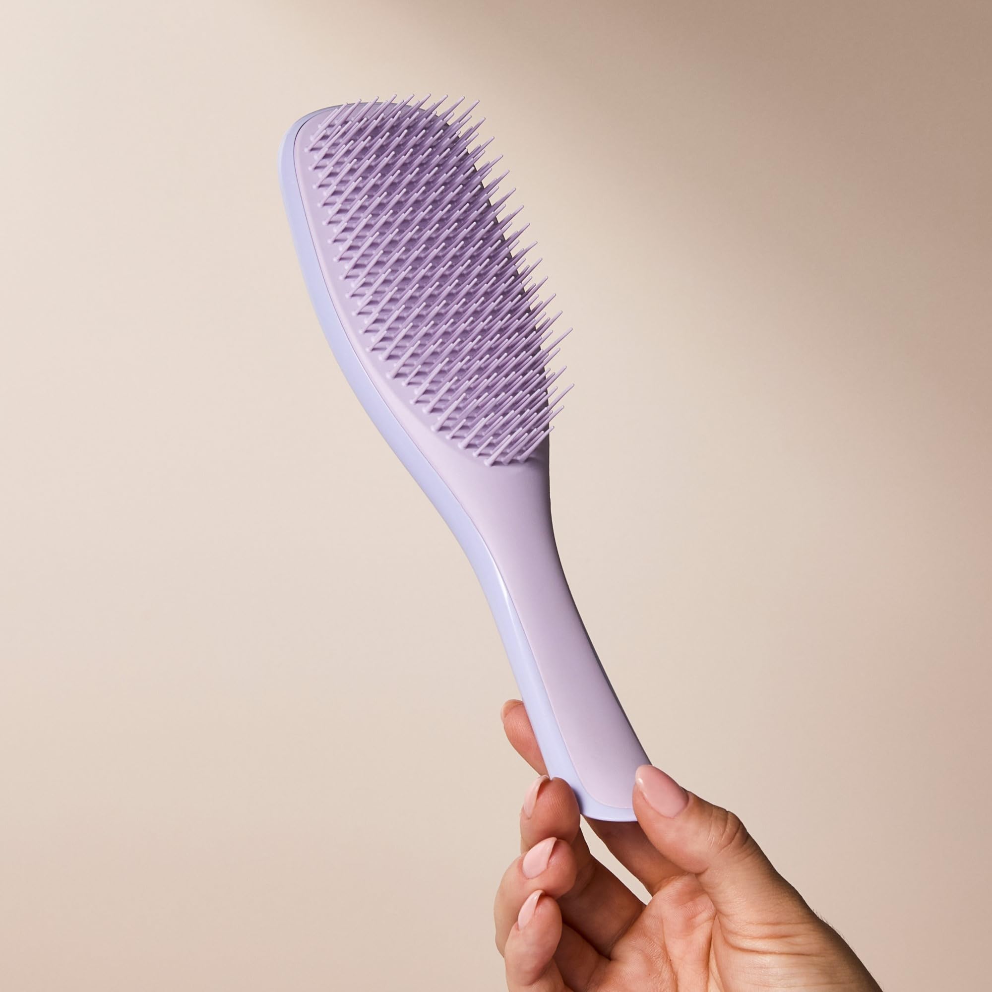 TANGLE TEEZER placed on bathroom counter in lifestyle scene for everyday styling convenience