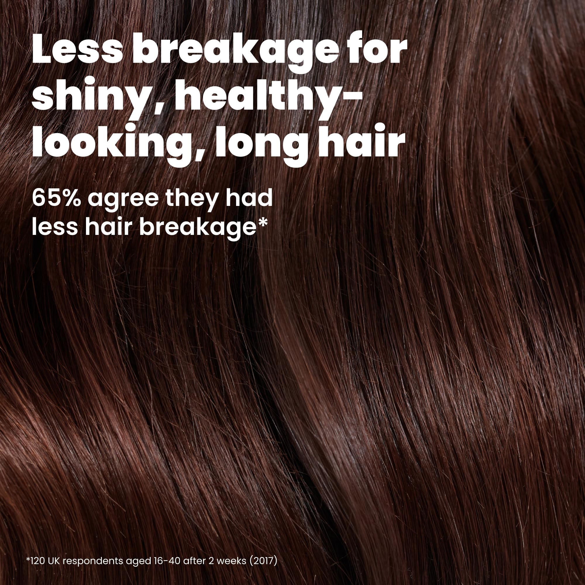 TANGLE TEEZER spreading conditioner evenly through long hair to improve manageability