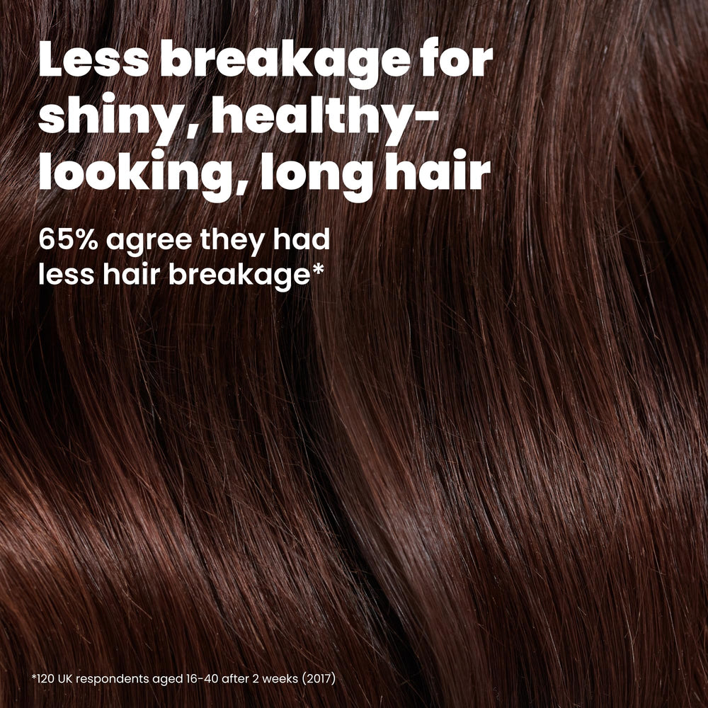 TANGLE TEEZER spreading conditioner evenly through long hair to improve manageability