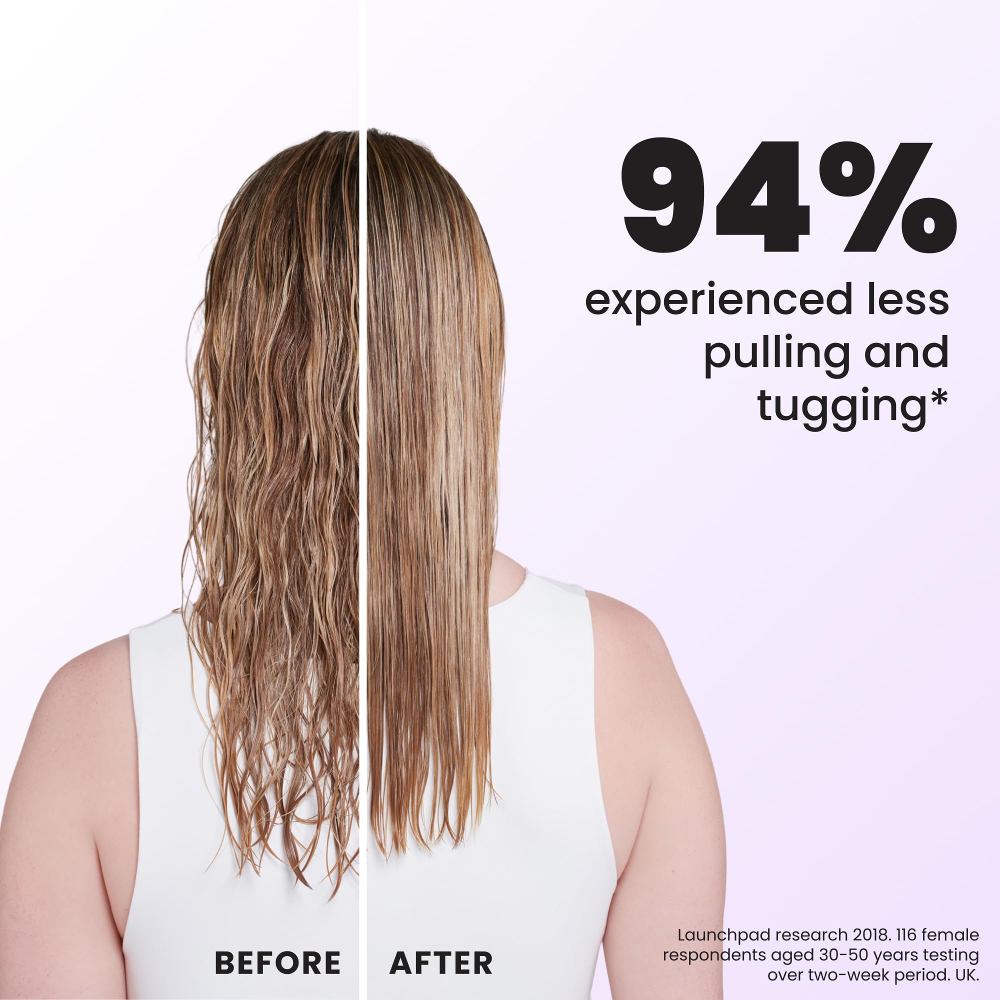 TANGLE TEEZER held in hand to illustrate size and easy handling for fine hair