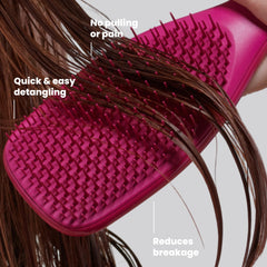 TANGLE TEEZER held in hand demonstrating compact size and travel-friendly benefit