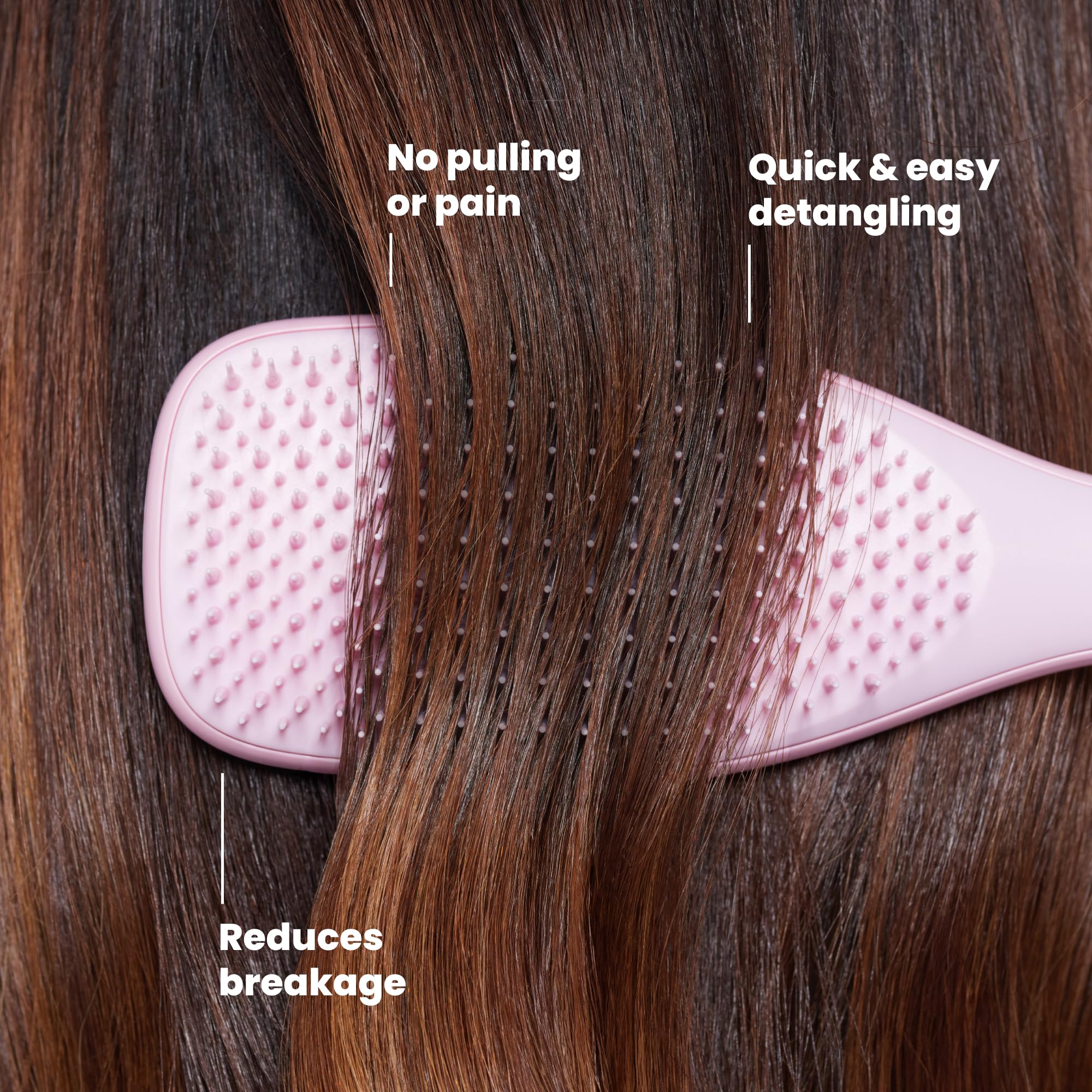 TANGLE TEEZER held in hand to show size and portability for travel convenience