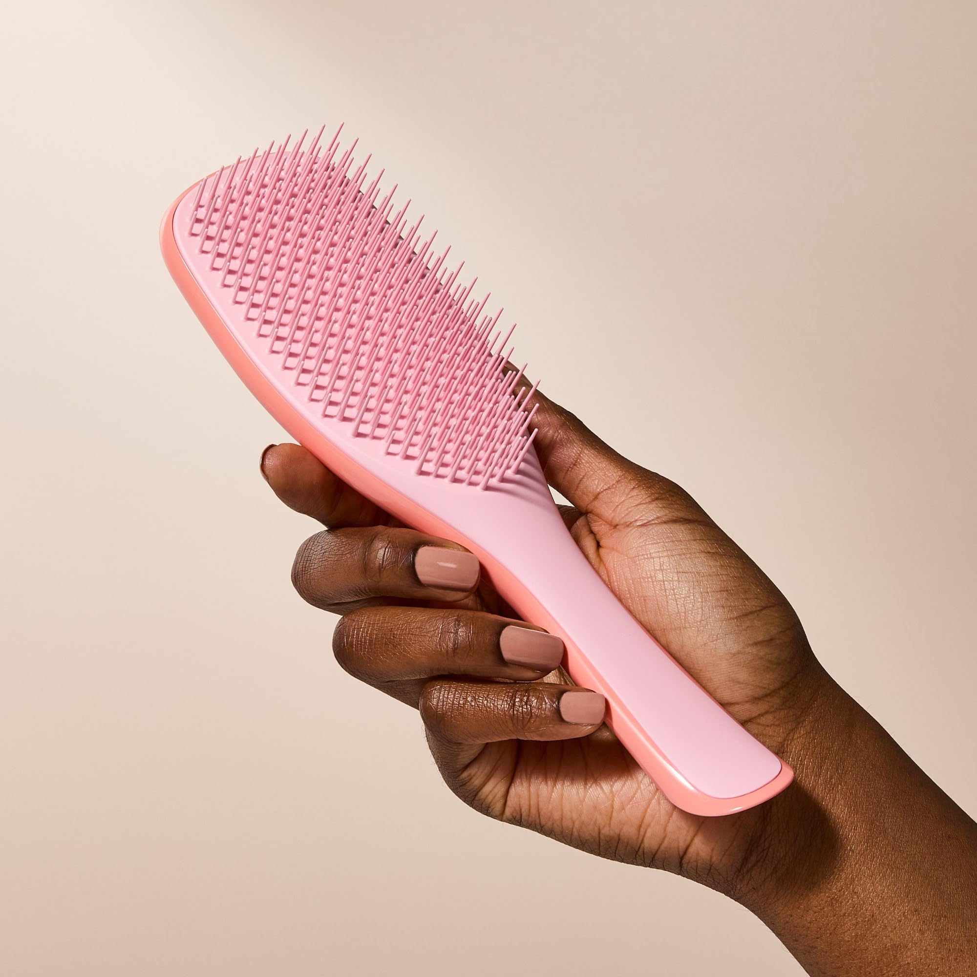 TANGLE TEEZER on bathroom shelf as a styling and care essential