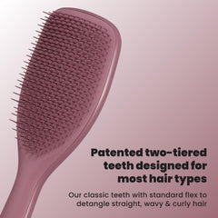 TANGLE TEEZER brush in hand illustrating paddle size for faster detangling