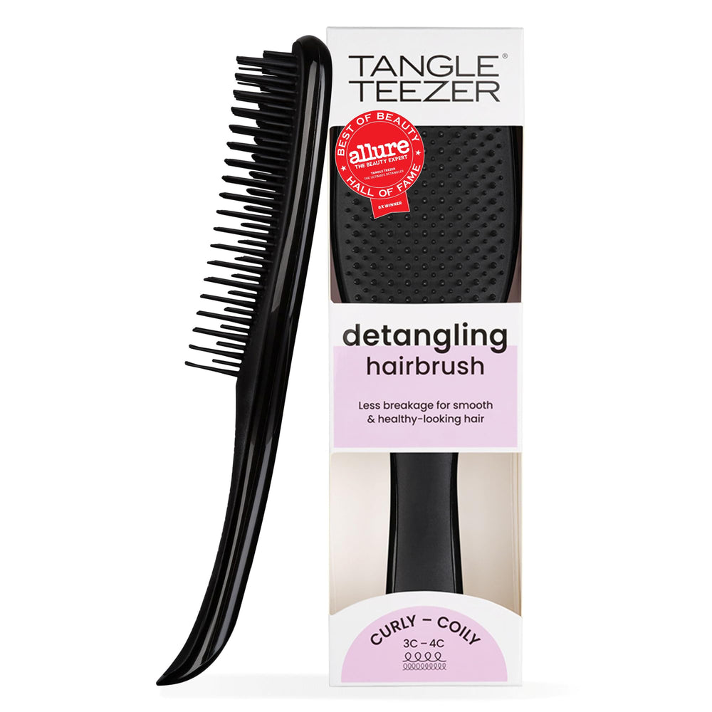 TANGLE TEEZER front view showing compact black brush and ergonomic grip for control